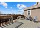Inviting back deck featuring modern patio furniture with views of the fenced backyard at 15753 E Indian Brook Cir, Parker, CO 80134