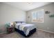 Bedroom featuring a queen-size bed, window with shutters, and side table at 15753 E Indian Brook Cir, Parker, CO 80134