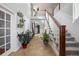 Elegant foyer with high ceilings, tiled floor, staircase, and decorative accents at 15753 E Indian Brook Cir, Parker, CO 80134