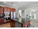 Kitchen island featuring dark countertops with sink, faucet, and cabinets at 15753 E Indian Brook Cir, Parker, CO 80134