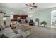 Open-concept living room leading to the kitchen with modern appliances and a cozy breakfast bar at 15753 E Indian Brook Cir, Parker, CO 80134