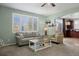 Inviting living room with natural light, neutral decor, and comfortable seating arrangements at 15753 E Indian Brook Cir, Parker, CO 80134