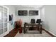 Bright home office featuring hardwood floors and overhead storage at 15753 E Indian Brook Cir, Parker, CO 80134