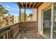 View from private balcony featuring wood railing and access to living space at 9700 E Iliff Ave # D44, Denver, CO 80231