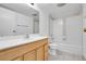 Bright bathroom featuring single sink vanity and shower over tub with classic tile and lighting at 9700 E Iliff Ave # D44, Denver, CO 80231