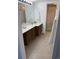 Classic bathroom featuring a single vanity, framed mirror, and a shower with a decorative floral curtain at 9700 E Iliff Ave # D44, Denver, CO 80231