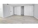 Bedroom featuring wood style floors, a large closet with sliding doors and a separate storage area at 9700 E Iliff Ave # D44, Denver, CO 80231