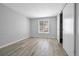 Bedroom with light hardwood flooring, window, and large closet space at 9700 E Iliff Ave # D44, Denver, CO 80231