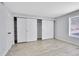 Bedroom with modern floors, large closet with sliding doors, and bright natural light at 9700 E Iliff Ave # D44, Denver, CO 80231