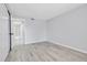 Neutral bedroom with closet, plank flooring, and attached bathroom at 9700 E Iliff Ave # D44, Denver, CO 80231