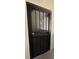 Secure front door with decorative metalwork offers both protection and aesthetic appeal at 9700 E Iliff Ave # D44, Denver, CO 80231