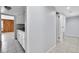 Hallway leading to the kitchen and rooms, with tile flooring at 9700 E Iliff Ave # D44, Denver, CO 80231