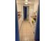 Galley kitchen featuring white cabinets and appliances, plus tile flooring at 9700 E Iliff Ave # D44, Denver, CO 80231