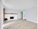 Spacious living room with white fireplace and mixed flooring at 9700 E Iliff Ave # D44, Denver, CO 80231