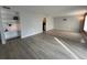 Spacious living room with built-in shelving and a seamlessly connected tile flooring area at 9700 E Iliff Ave # D44, Denver, CO 80231
