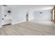 Open living space with mixed flooring and a built in shelving unit at 9700 E Iliff Ave # D44, Denver, CO 80231