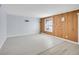 Spacious living room with neutral paint and access to kitchen at 9700 E Iliff Ave # D44, Denver, CO 80231