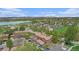 An aerial view of the community with a large lake and mountain views in the background at 718 Julian Cir, Lafayette, CO 80026