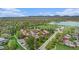 The community is surrounded by lush greenery, a lake, mountains, and clear blue sky at 718 Julian Cir, Lafayette, CO 80026
