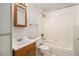 This clean bathroom features tile, a sink with a vanity, and a bathtub with shower at 718 Julian Cir, Lafayette, CO 80026