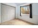 Comfortable bedroom with a spacious closet and natural light from the window at 718 Julian Cir, Lafayette, CO 80026