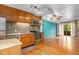 Bright kitchen with stainless steel appliances and adjacent living area at 718 Julian Cir, Lafayette, CO 80026