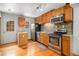 Functional kitchen with stainless steel appliances and hardwood floors at 718 Julian Cir, Lafayette, CO 80026