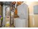 This utility room features a stacked washer and dryer, as well as space for storage at 718 Julian Cir, Lafayette, CO 80026