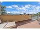 Private balcony with wood decking and a view of the surrounding neighborhood and mountain landscape at 756 Dreamcatcher Ln, Evergreen, CO 80439
