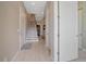 Inviting hallway with staircase and tile flooring, offering a glimpse into the home's layout at 756 Dreamcatcher Ln, Evergreen, CO 80439