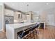 Sleek, modern kitchen with a large island, stainless steel appliances, and a built-in wine cooler at 756 Dreamcatcher Ln, Evergreen, CO 80439