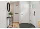 Bright entryway featuring hardwood floors, a stylish mirror, and a convenient console table at 28254 Tresine Dr, Evergreen, CO 80439