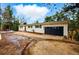 Charming single-story home with a well-maintained yard and a spacious driveway surrounded by lush trees at 28254 Tresine Dr, Evergreen, CO 80439