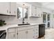 Bright kitchen with stainless steel appliances, white countertops and modern fixtures at 28254 Tresine Dr, Evergreen, CO 80439