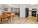 Open concept with dining area, kitchen and living room, featuring hardwood floors at 28254 Tresine Dr, Evergreen, CO 80439