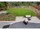 Landscaped backyard with a well-manicured lawn and an outdoor seating area at 1321 W Caley Ave, Littleton, CO 80120