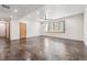 Spacious basement area with natural light, modern fixtures, and a smooth concrete floor at 1321 W Caley Ave, Littleton, CO 80120