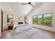 Bright bedroom with vaulted ceiling, large windows, and wood floors at 1321 W Caley Ave, Littleton, CO 80120