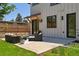 Cozy patio featuring outdoor seating and stylish architectural details and fresh landscaping at 1321 W Caley Ave, Littleton, CO 80120