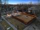 This aerial view highlights a fully fenced yard, cozy patio with firepit, and charming exterior at 2033 E 21St Ave, Denver, CO 80205