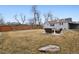 Spacious backyard with a patio seating area, rock landscaping, and wood fence at 2033 E 21St Ave, Denver, CO 80205