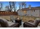 Inviting backyard area with patio, fire pit, and comfortable seating; perfect for entertaining at 2033 E 21St Ave, Denver, CO 80205