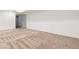 Large, unfinished basement area with neutral carpet and white walls at 2033 E 21St Ave, Denver, CO 80205