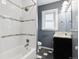 Updated bathroom with white subway tile, modern fixtures, and stylish vanity at 2033 E 21St Ave, Denver, CO 80205
