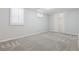 Bedroom with neutral carpet, bright windows, and a closet with white, sliding doors at 2033 E 21St Ave, Denver, CO 80205