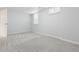 Bedroom with neutral carpet, bright windows, and a white interior door at 2033 E 21St Ave, Denver, CO 80205