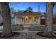 Charming home with a cozy front porch, well-manicured landscaping, and beautiful stone accents at 2033 E 21St Ave, Denver, CO 80205