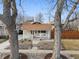 Charming single-story home with a front porch, landscaping, and walkway at 2033 E 21St Ave, Denver, CO 80205