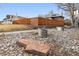 View of rock landscaping and fenced yard at 2033 E 21St Ave, Denver, CO 80205
