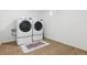 Laundry room features a washer and dryer, and a neutral-colored tile floor at 2033 E 21St Ave, Denver, CO 80205